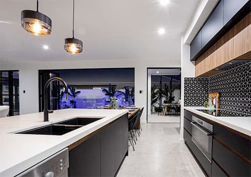 new modern kitchen with black cabinetry - Sunshine Coast